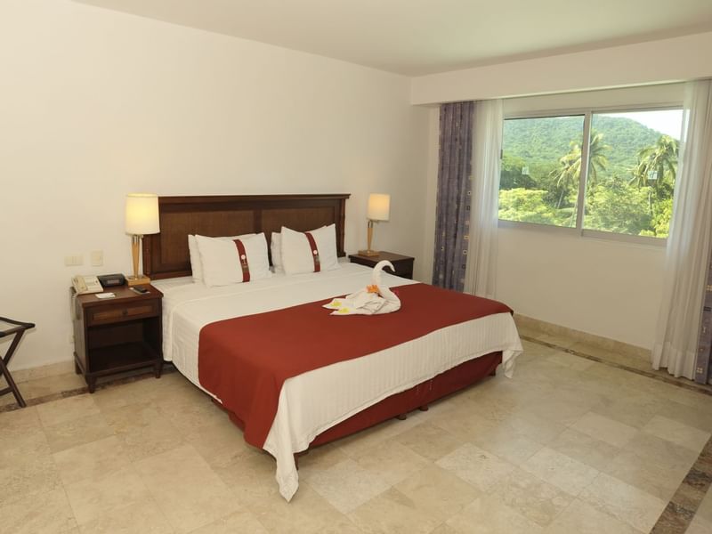 Superior King with bed & an open window at Gamma Hotels