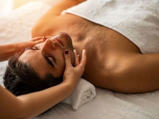 A gentleman getting a facial in the spa at Ana Hotels Europa