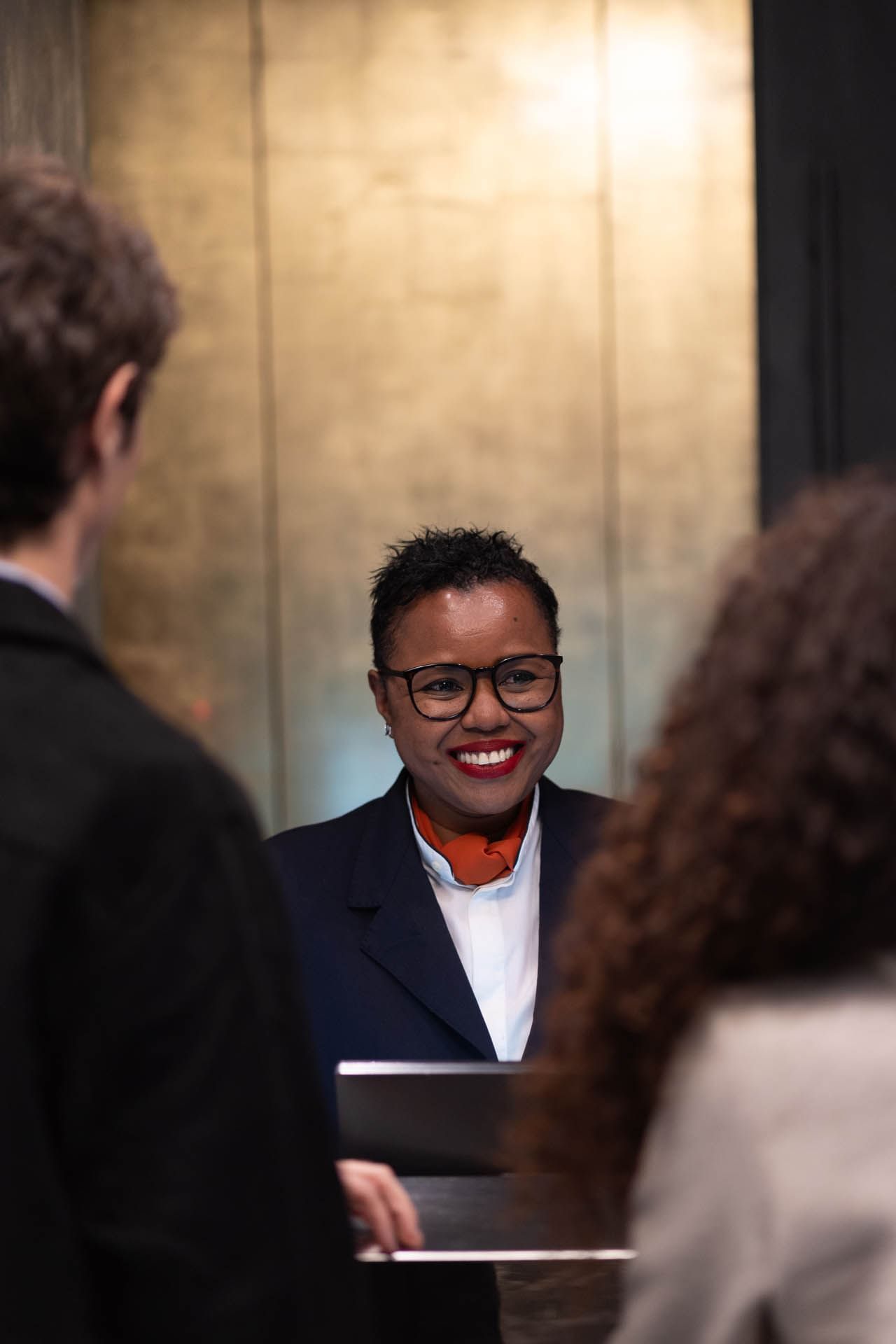 Couple checking-in by the front desk using the help of a receptionist at The Style