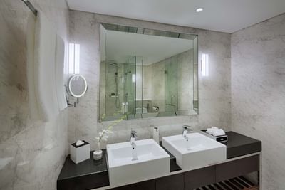 hotel bathroom with marble finishing and double sink