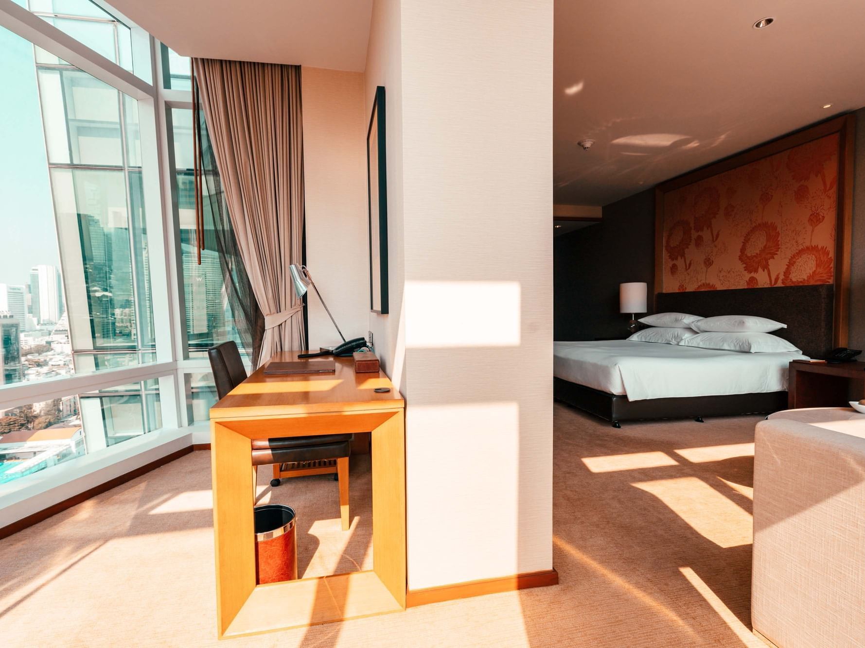 Working desk and kingbed in Room at Eastin Hotels