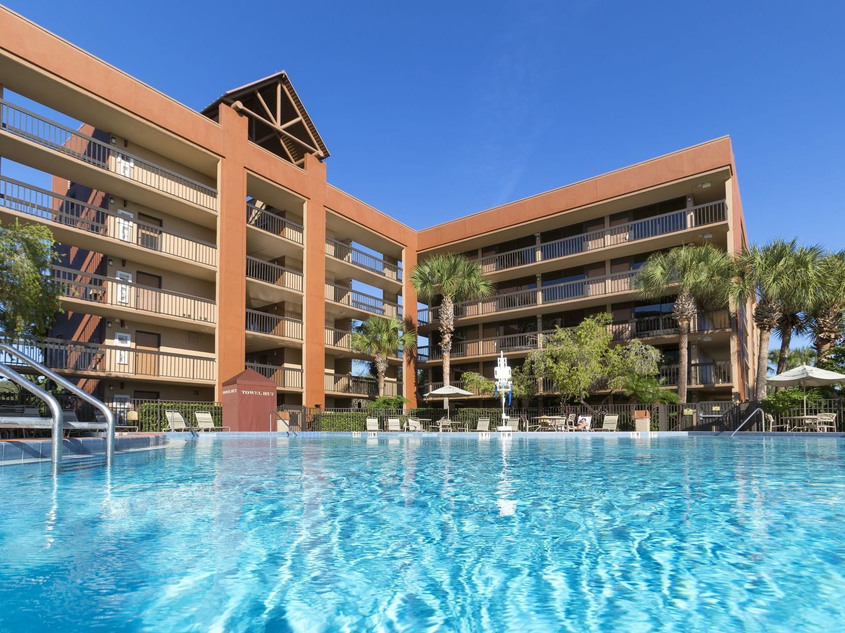 Outdoor pool area & hotel at Rosen Inn Lake Buena Vista