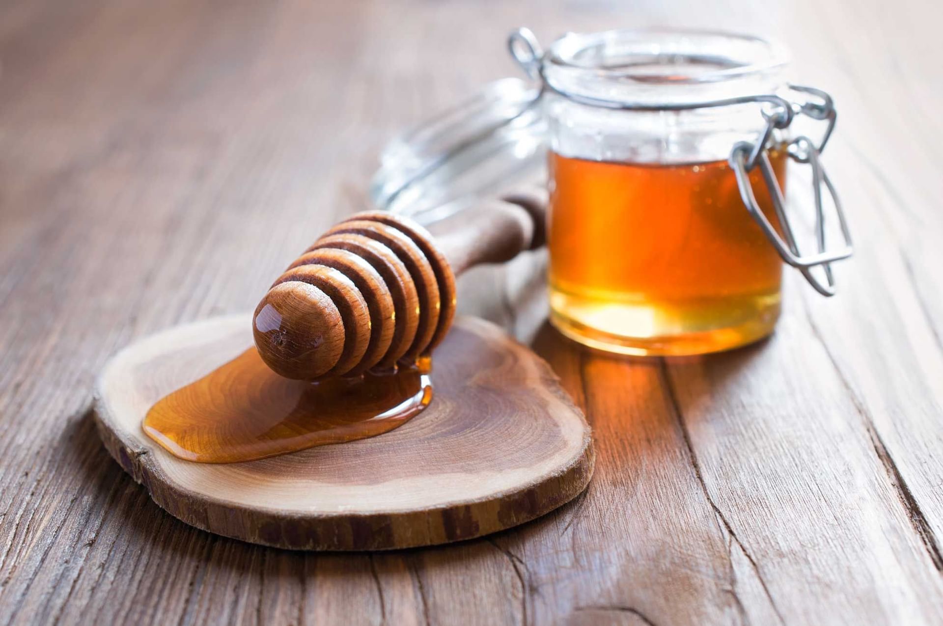 Honey in jar with wooden dipper at Novotel Barossa Valley