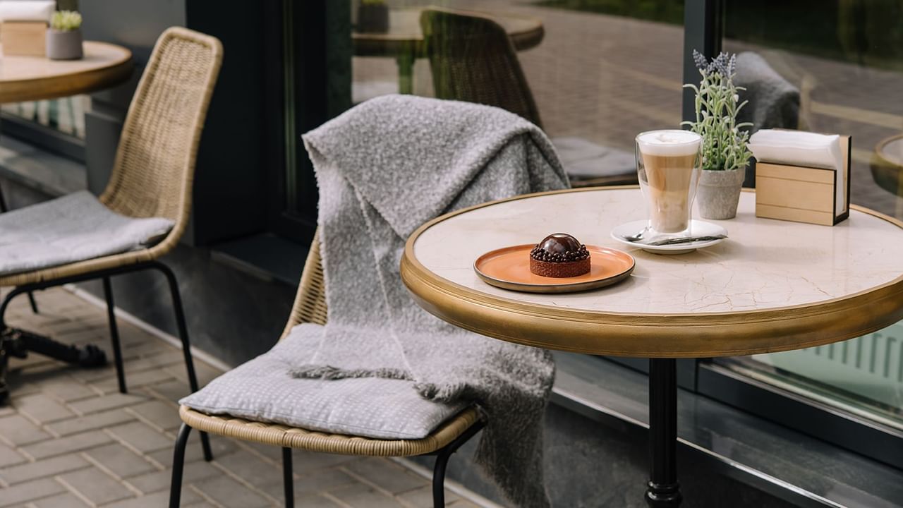 Coffee and dessert on an outdoor patio of a coffee shop