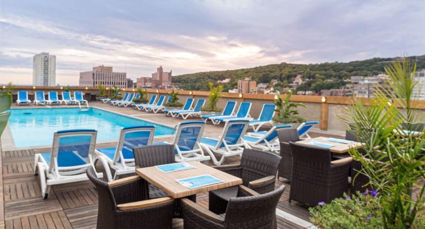 Sunbeds by the Rooftop pool with a view at Le Cantlie Suites