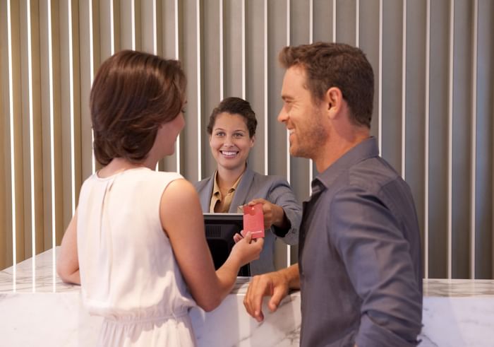 A couple and receptionist -Novotel Sydney Olympic Park