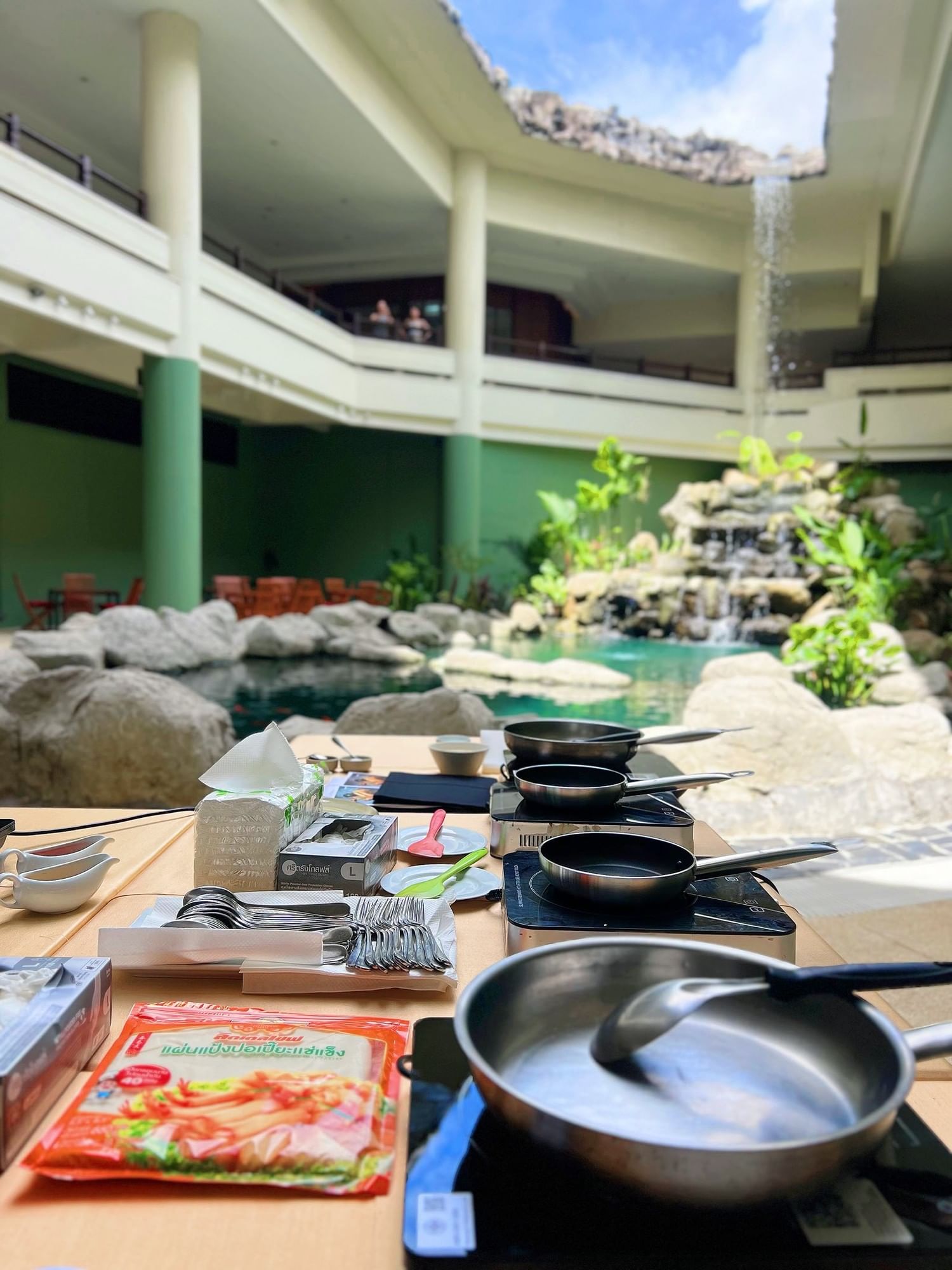 A private Thai Cooking Class Set up at Koi Pond, at one of the best family friendly hotels in Phuket