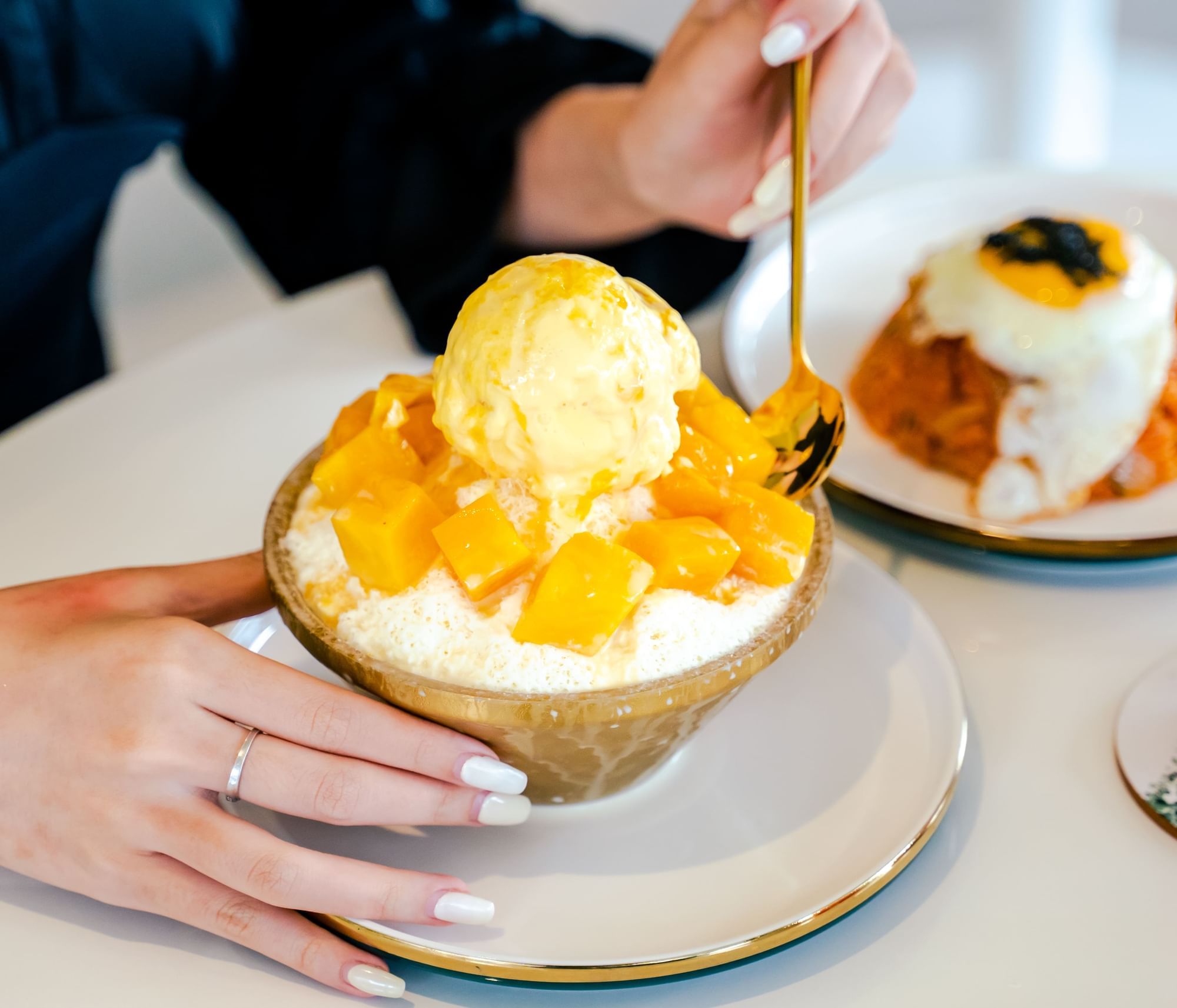A woman having a Mango Ice Cream in Sunway Boulevard 88 near Sunway Hotel Big Box