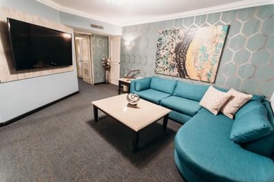 TV & sofa in Governor Suite Livingroom at Araiza Mexicali