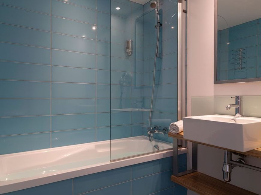 Bathtub by the bathroom vanity area in Superior Room at Hotel Saint James