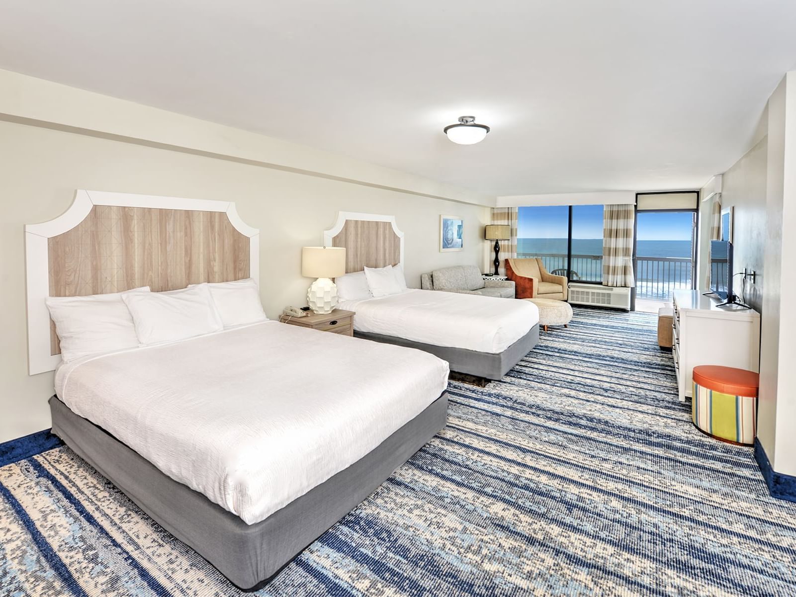 Two beds with ocean view in Deluxe Ocean Front Kitchenette at Bahama House, Daytona Beach.