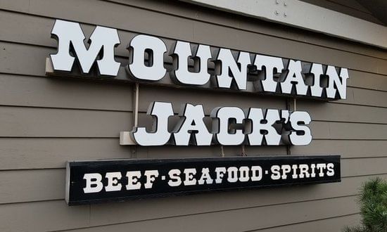 Mountain Jack's sign on a wall near The Whittaker Inn