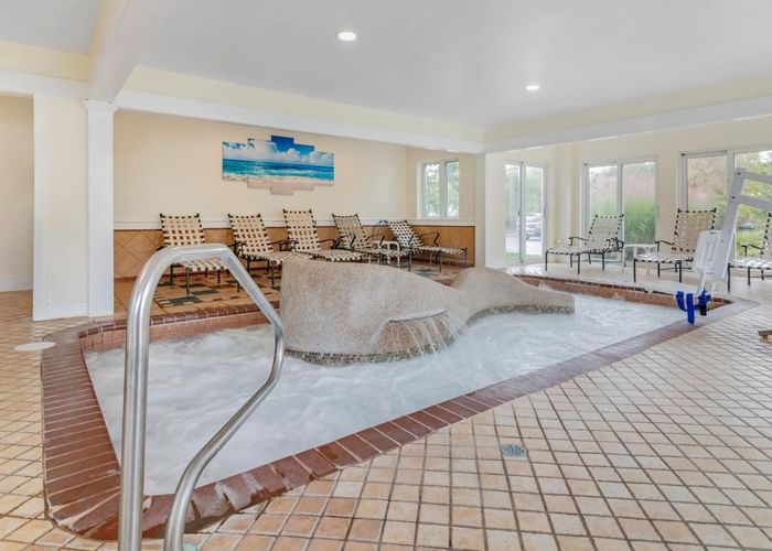 Lounge chairs by the indoor pool area at Meadowmere Resort