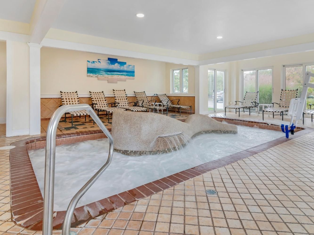 Serene spa setting with hot tub & lounge chairs in Day Spa at Meadowmere Resort