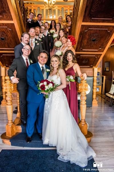 Wedding group posing on the stairs at Horton Grand Hotel