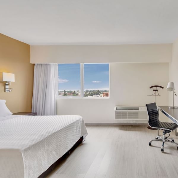 Comfy king bed in Superior Room at Fiesta Inn Hotels