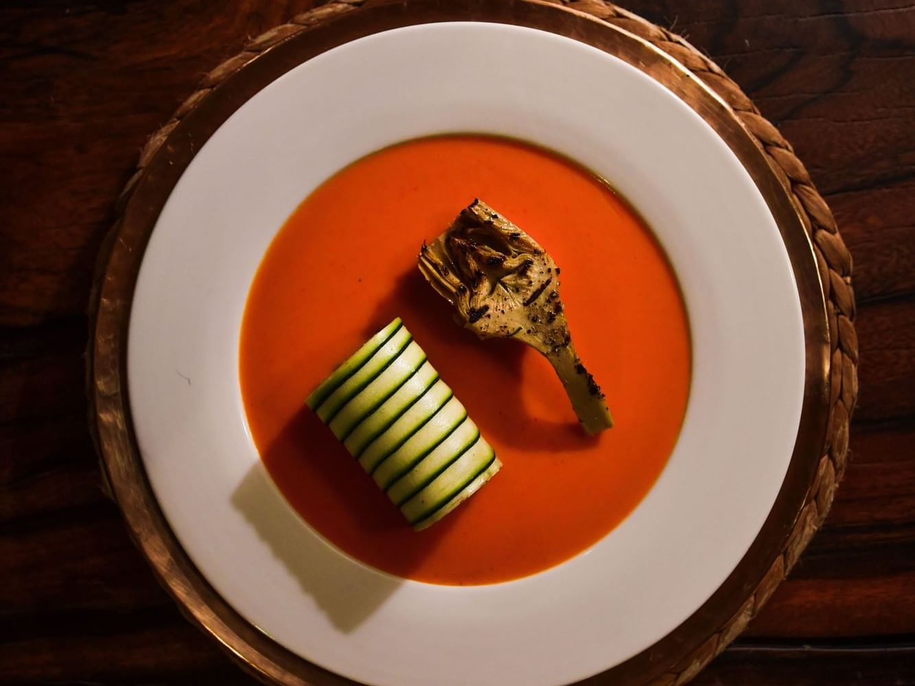 Red tomato soup with grilled artichoke and cucumber roll served in Nature’s Flavours at Dwarika's Himalayan Wellbeing
