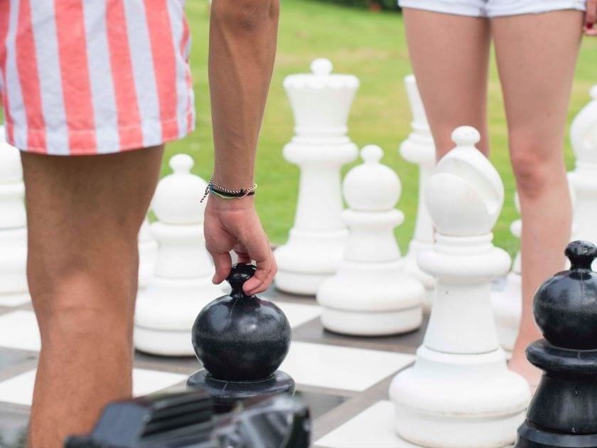 Knee level shot of outdoor Giant Chess game at Fiesta Resort