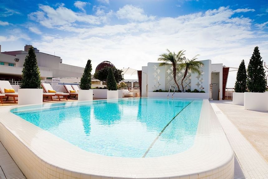 Pool area with pool chairs at Dream South Beach