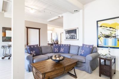 Living area with cozy sofa set-up of Apartment 406 at Retro Suites Hotel