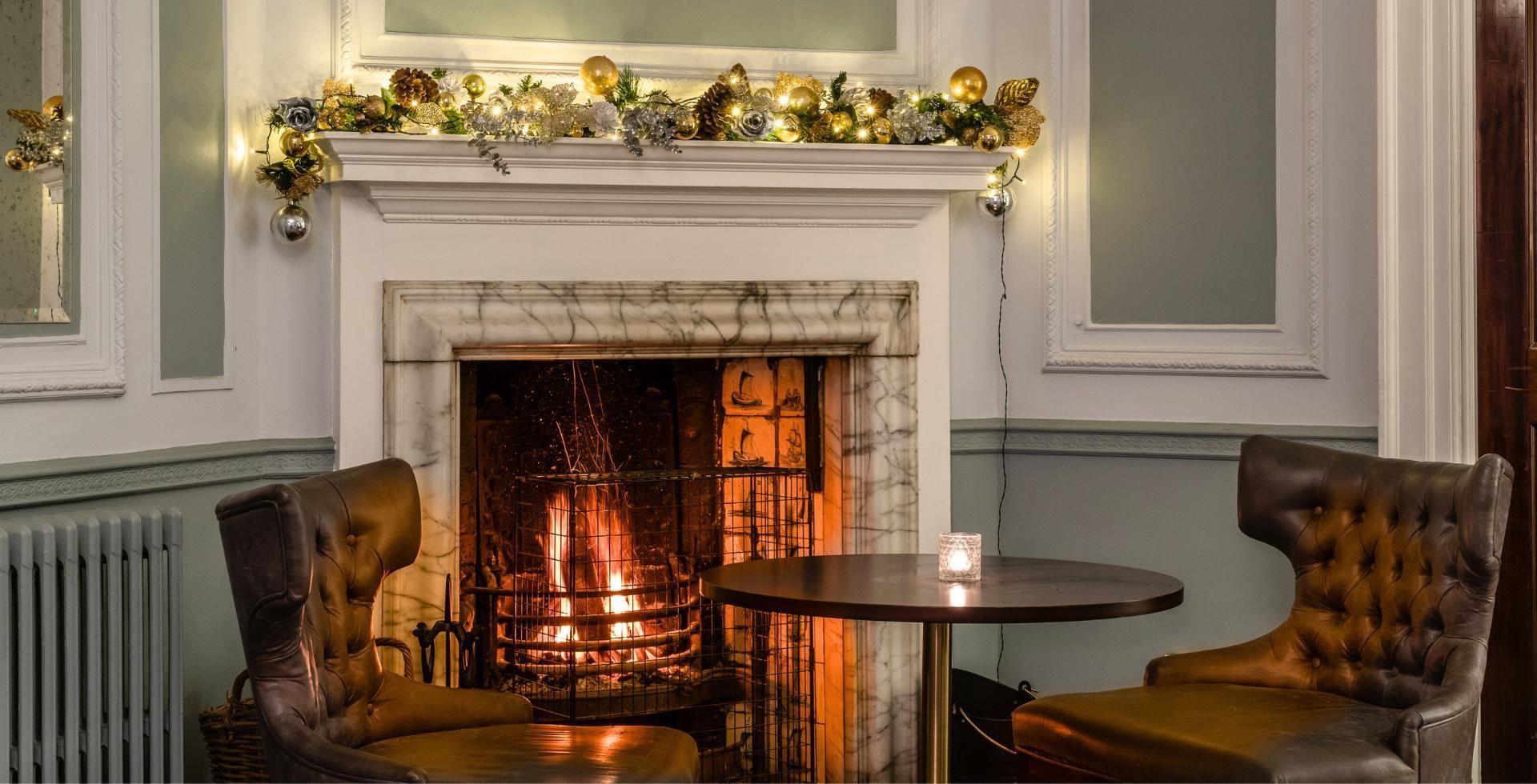 Festive Christmas fireplace at Gorse Hill featuring amazing Twixmas breaks