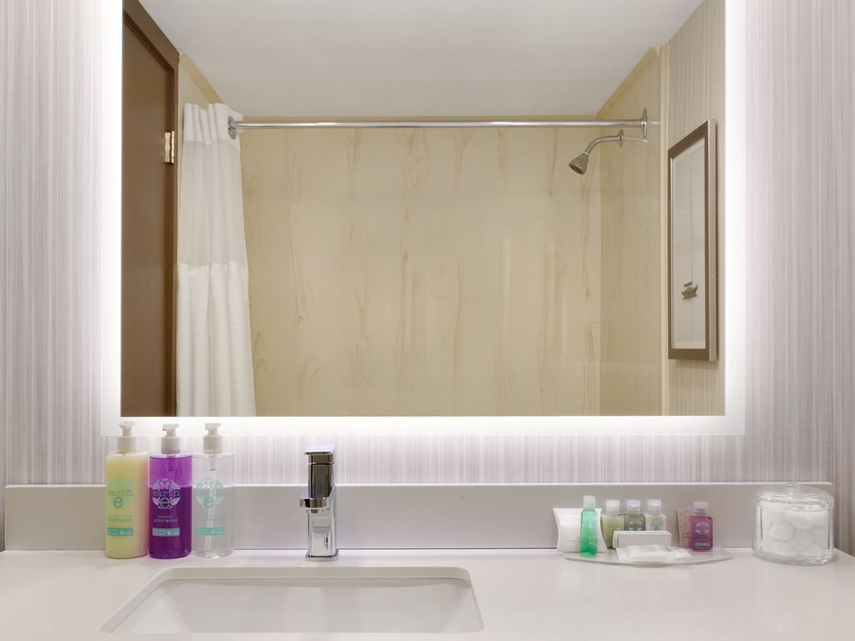 Sink and mirror in hotel bathroom