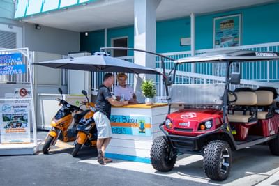 a man rending a motorized scooter