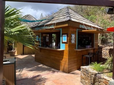 Wooden Emerald Cafe at Emerald Beach Resort, open-air flavors at a St. Thomas resort with beach bar and Caribbean restaurant