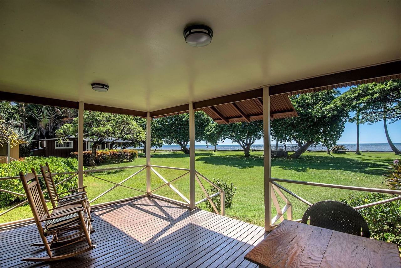 patio view at Waimea Plantation Cottages with rockers and a table