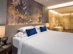 Interior of a room with a king bed at Chatrium Grand