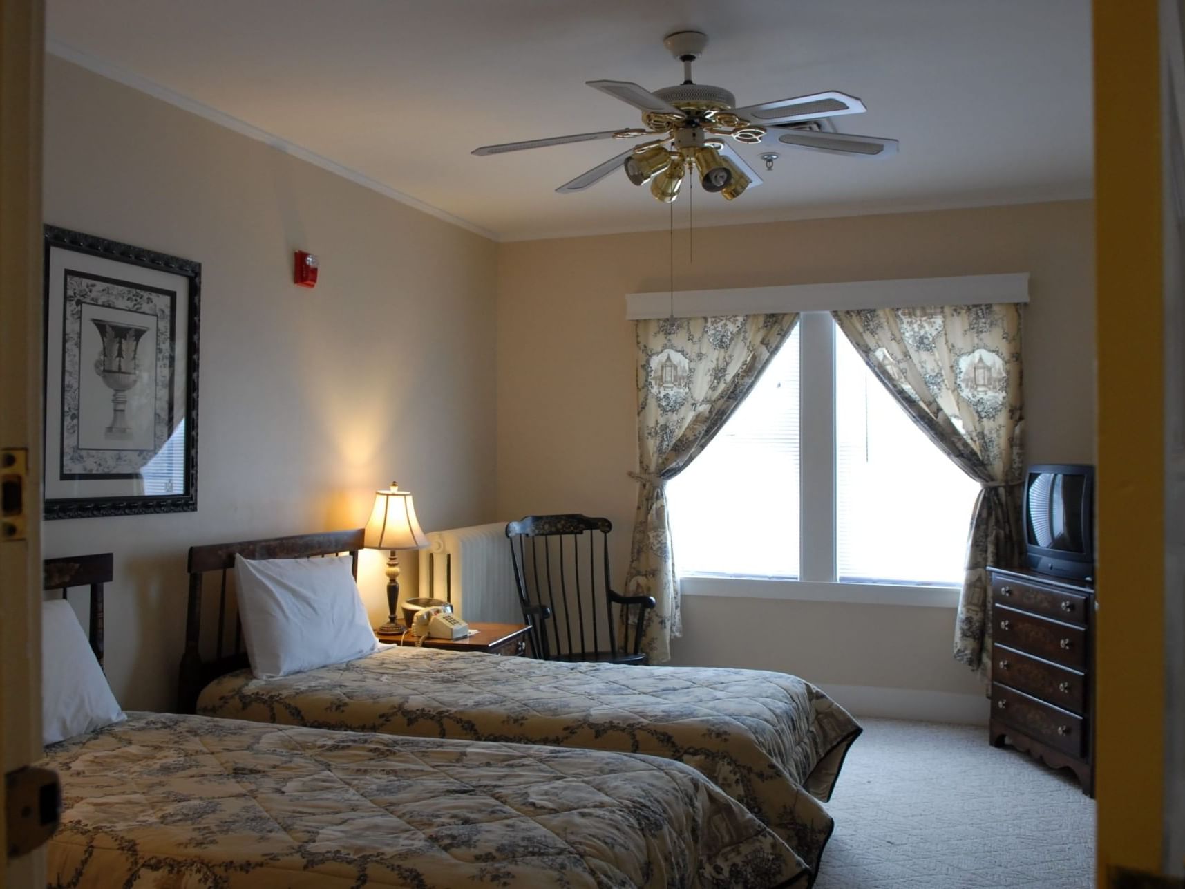 Two cozy beds, side cupboard with TV & nightstand in Two Bedroom Townhouse at The Bethel Inn Resort & Suites