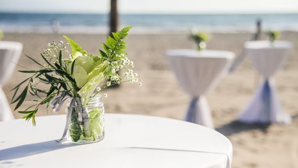 Floral table setup by the beach at Hotel Villa Varadero