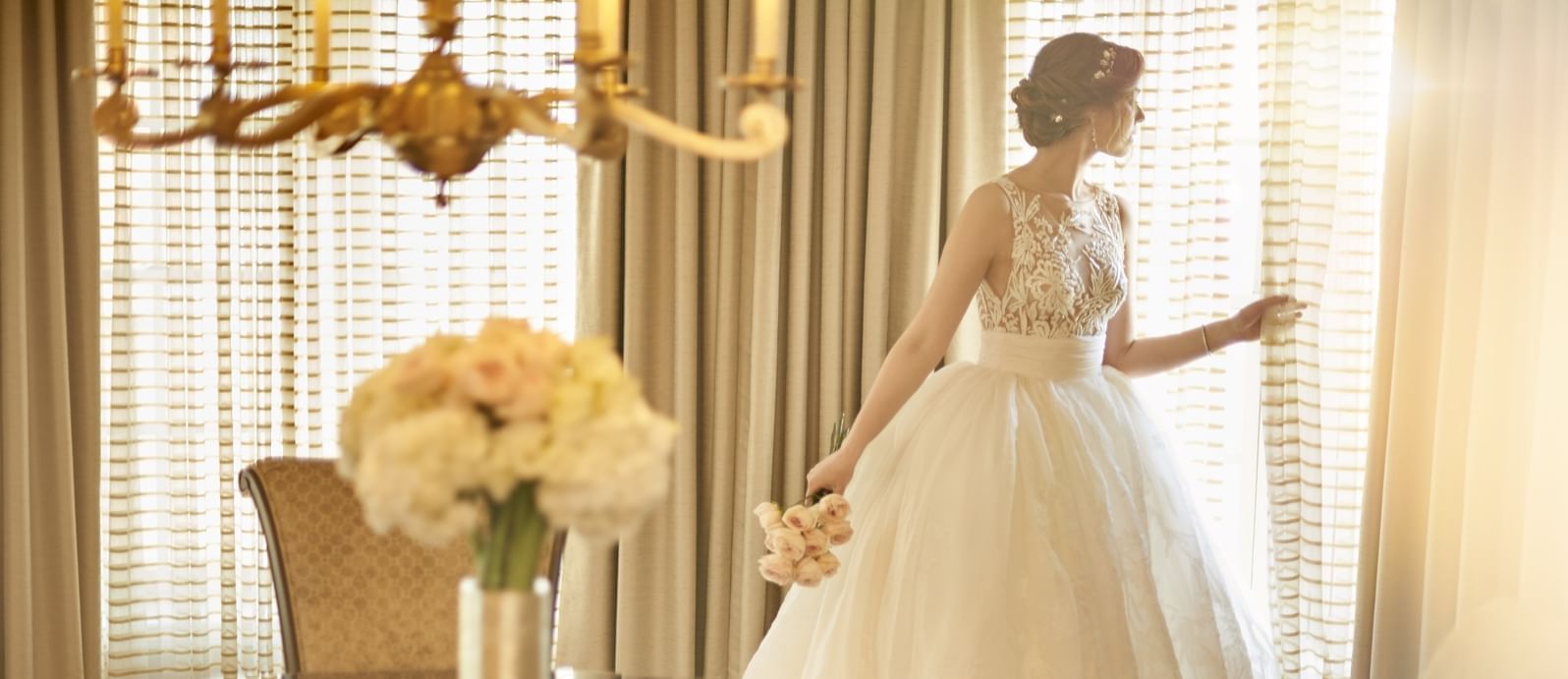 a bride looking out a window