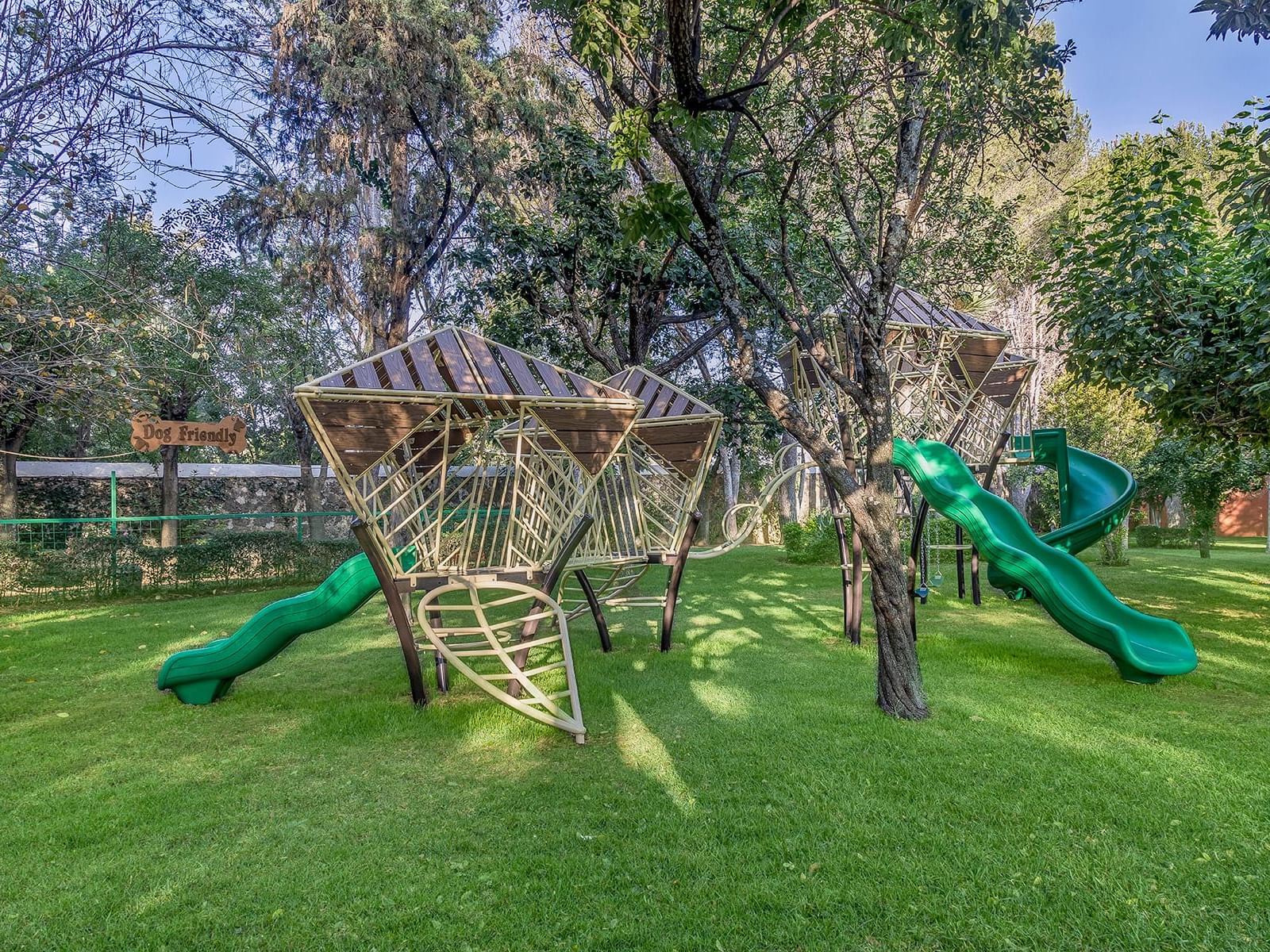 Outdoor activity area with slides at La Colección Resorts