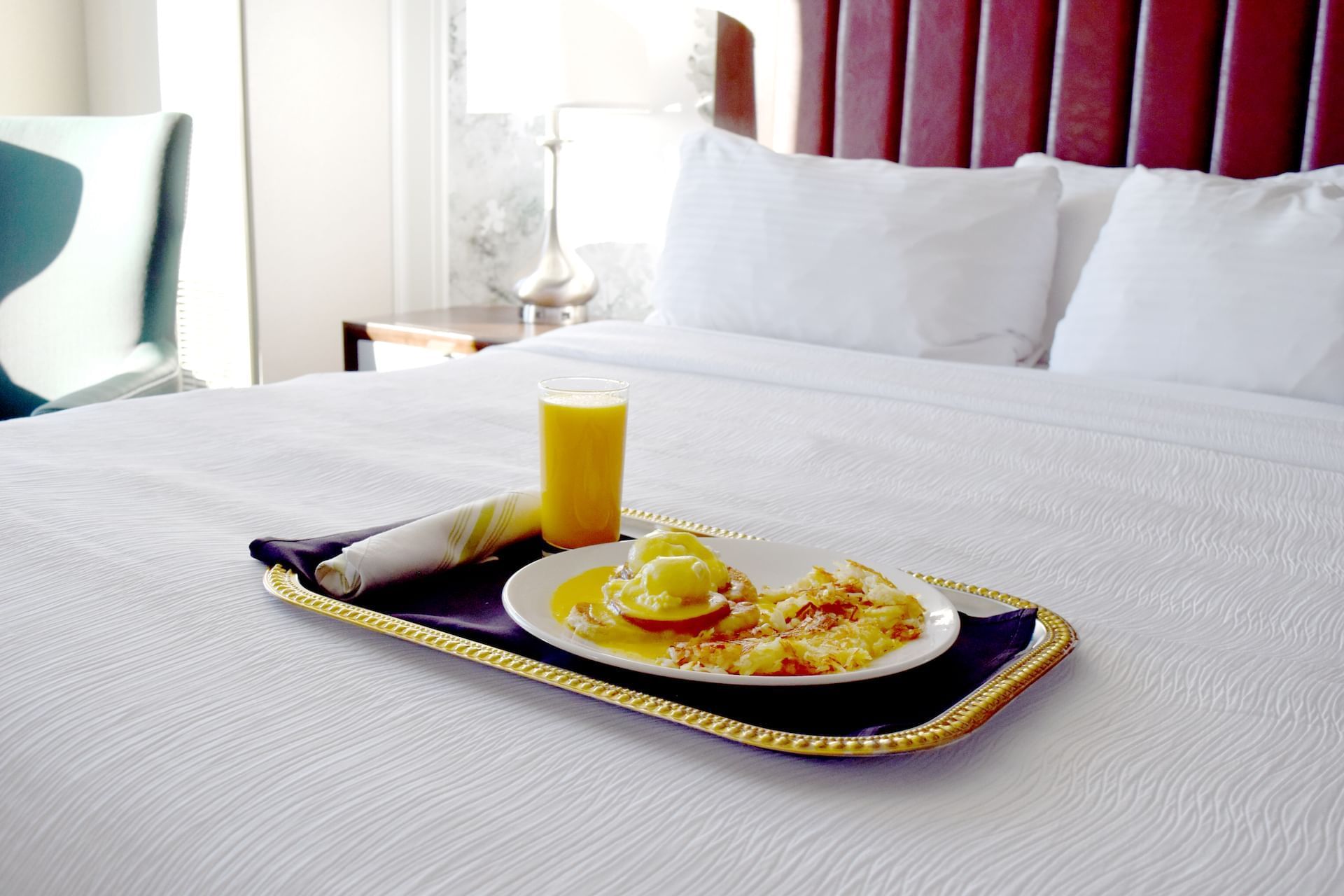 Breakfast served on a bed at The Grove Hotel