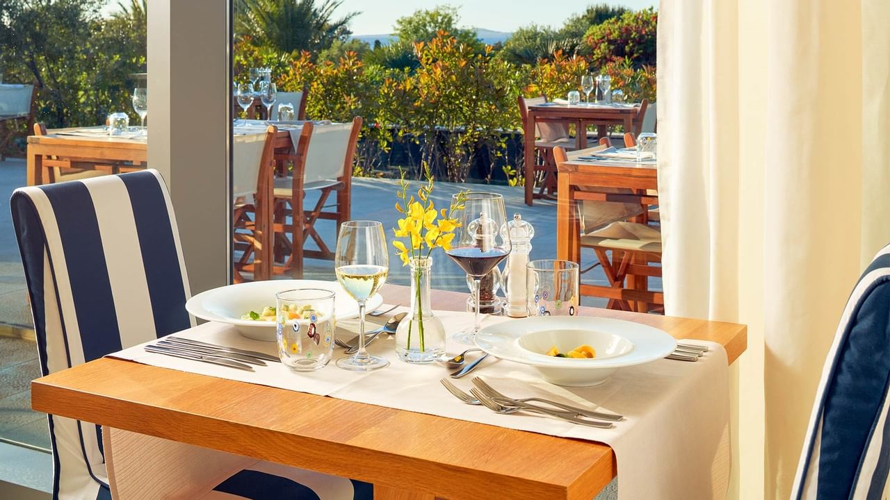 Served meal & wine on a restaurant table, Falkensteiner Hotels