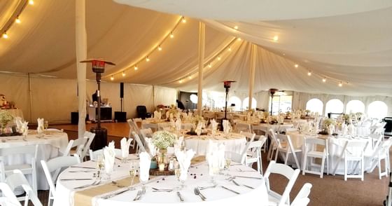 Banquet setup for an event in Lakeside Tent at Honor’s Haven Retreat