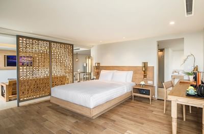 Bed & working table in Suite at Eastin Ashta Resort Canggu