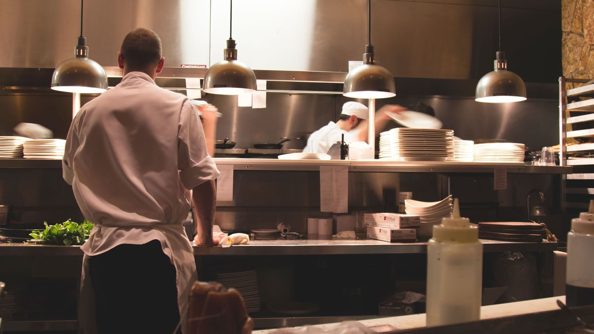 Chefs are cooking in the kitchen at The Original Hotels