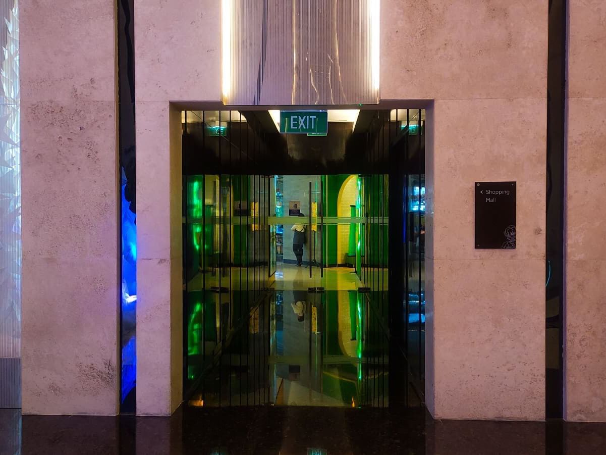 Elevator by the well-lit lobby area at Po Hotel Semarang