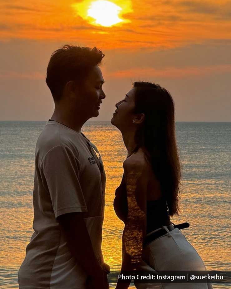 couple sharing a romantic moment during sunset on the beach