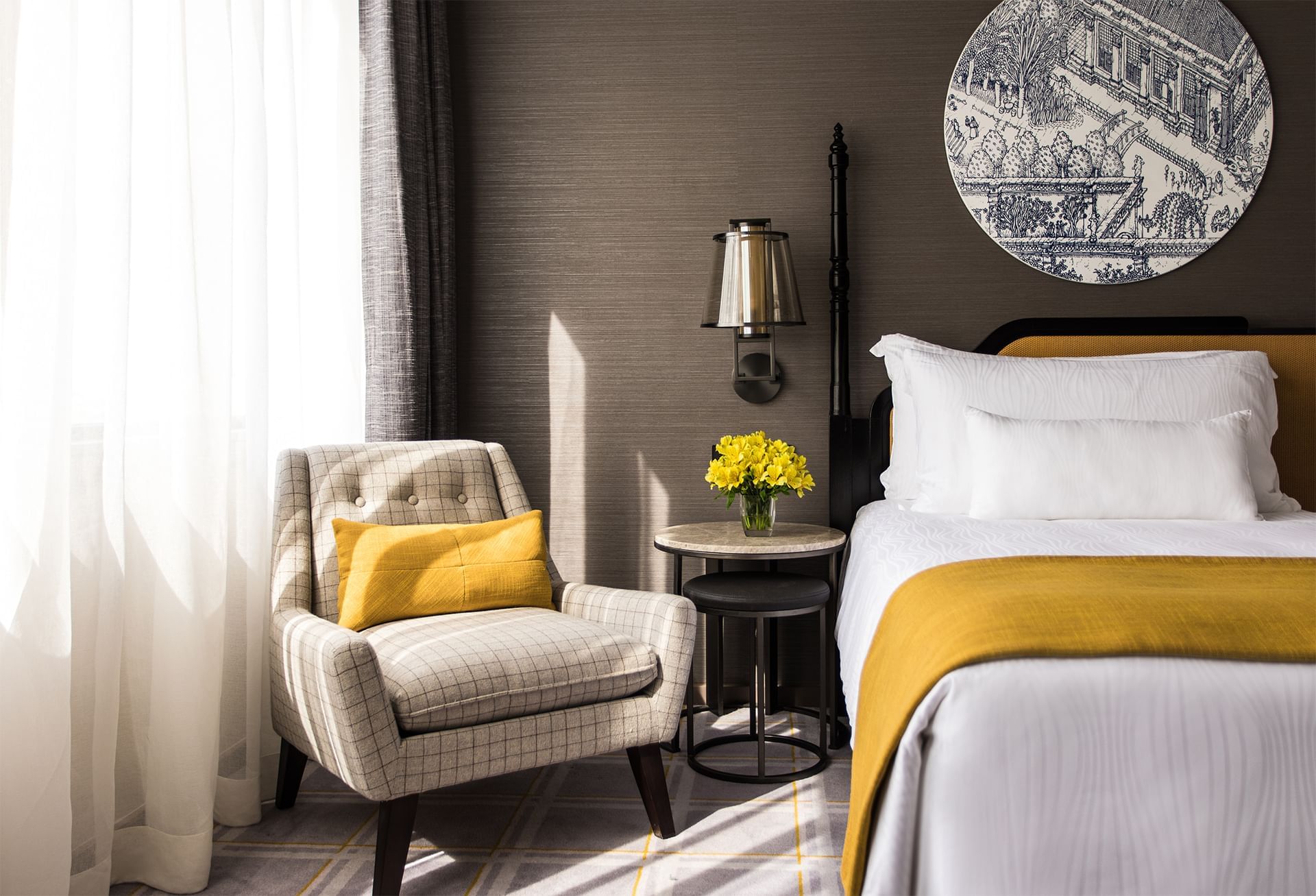 Chair near a bed in the Deluxe Twin Room at Artyzen Grand Lapa