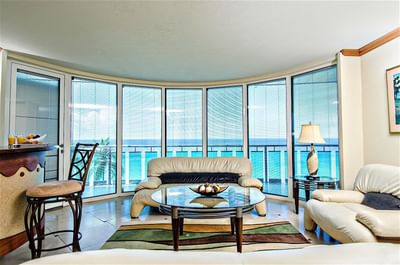 The living area of Oceanfront Suite with a balcony at Accra Hotels & Resorts