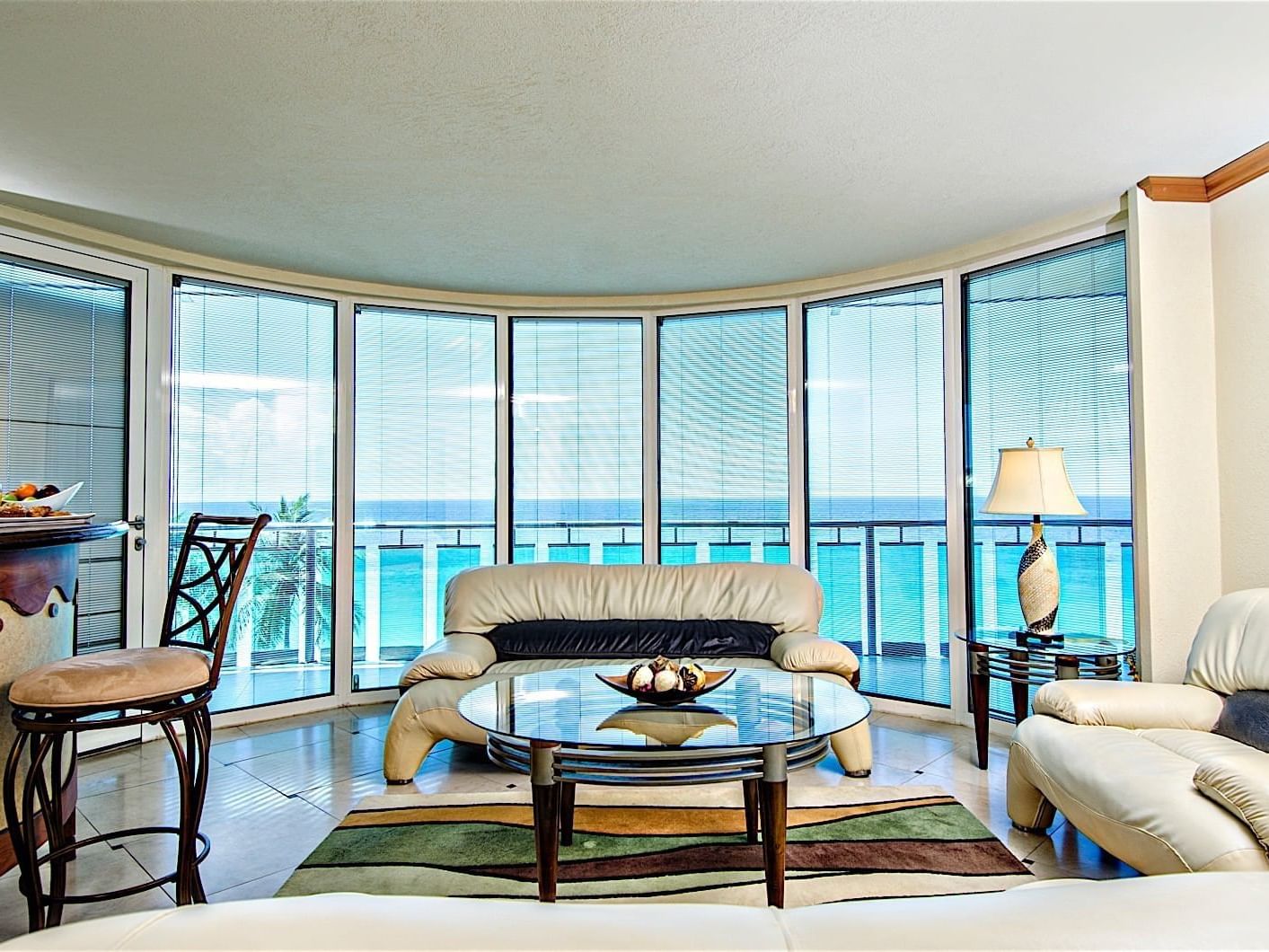 The living area of Oceanfront Suite with a balcony at Accra Hotels & Resorts