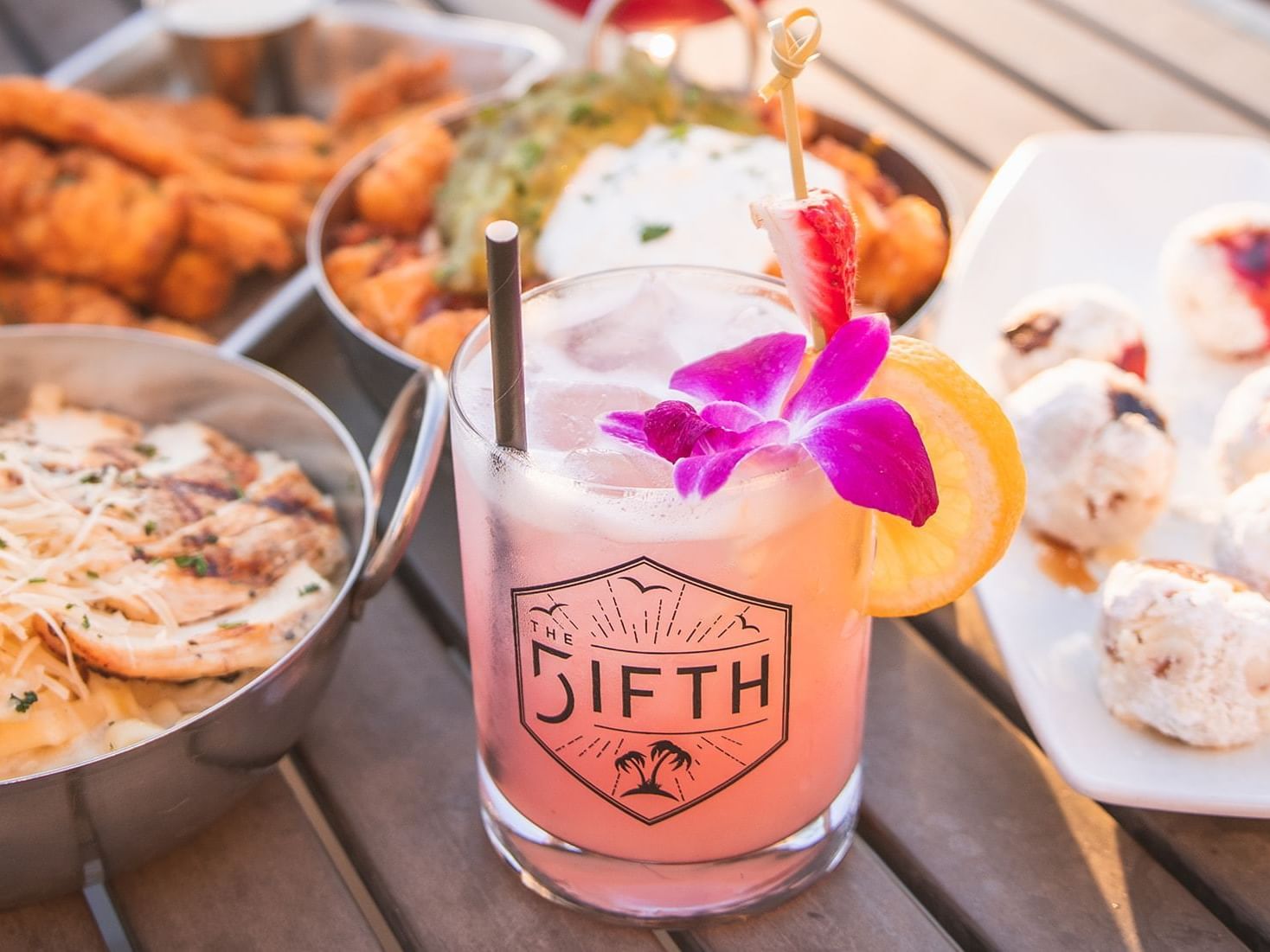 Signature cocktail and food at The FIFTH
