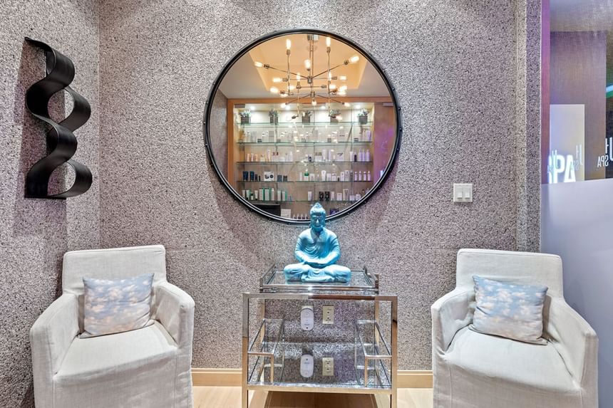 Spa lounge area with a buddha statue at J House Greenwich