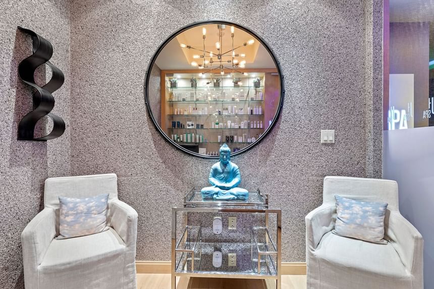 Spa lounge area with a Buddha statue at J House Greenwich, a luxury hotel in Fairfield County for business travelers