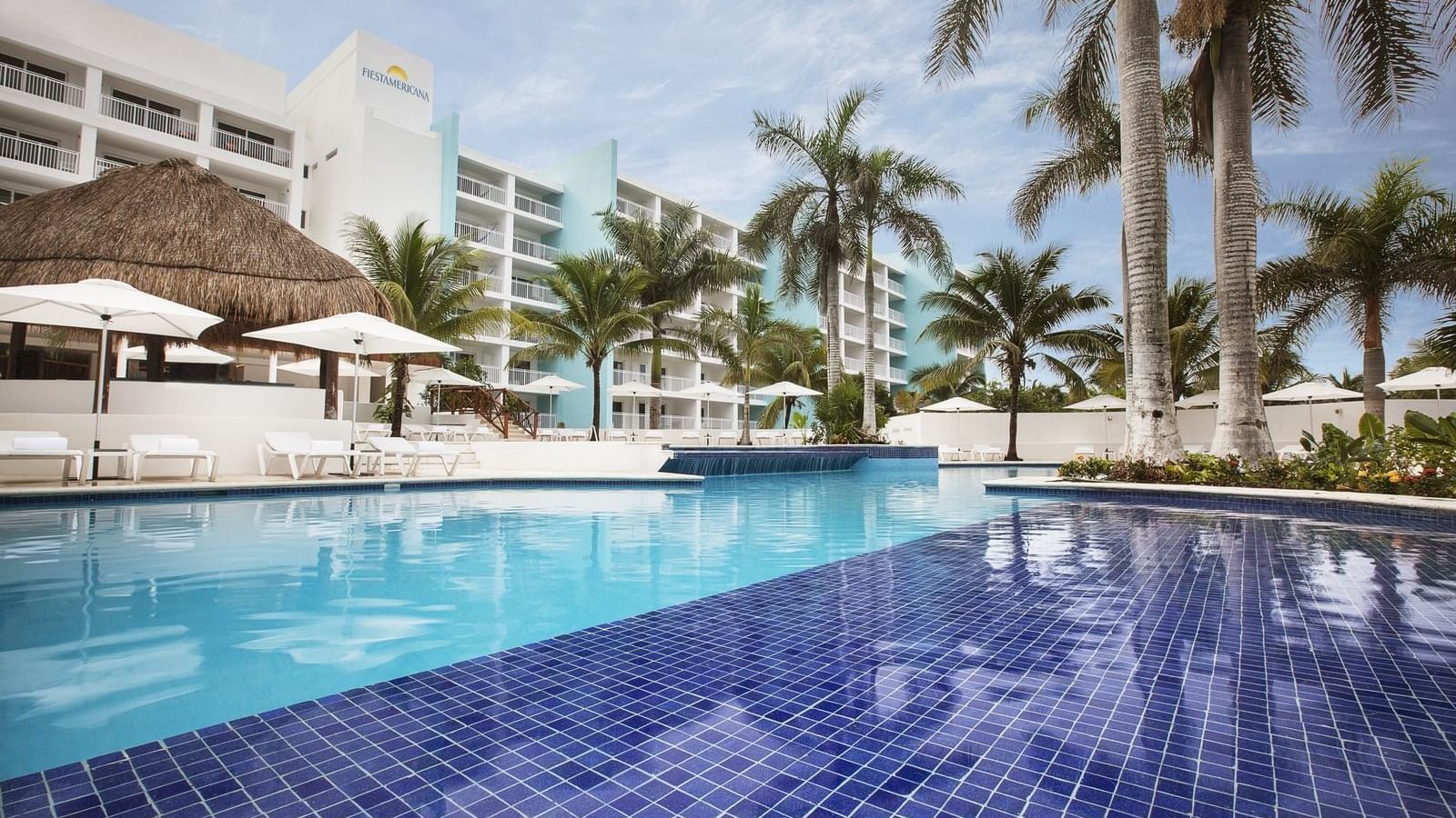 Outdoor pool & sun beds at FA Cozumel All Inclusive