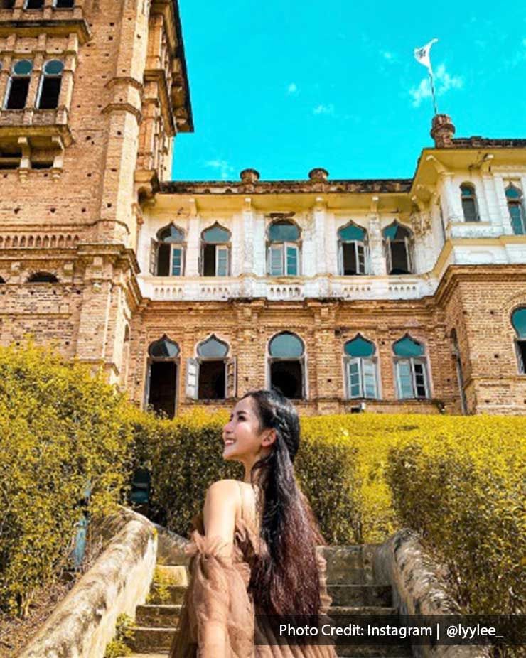 A lady was taking a picture in the Kellie’s Castle - Lexis Suites Penang