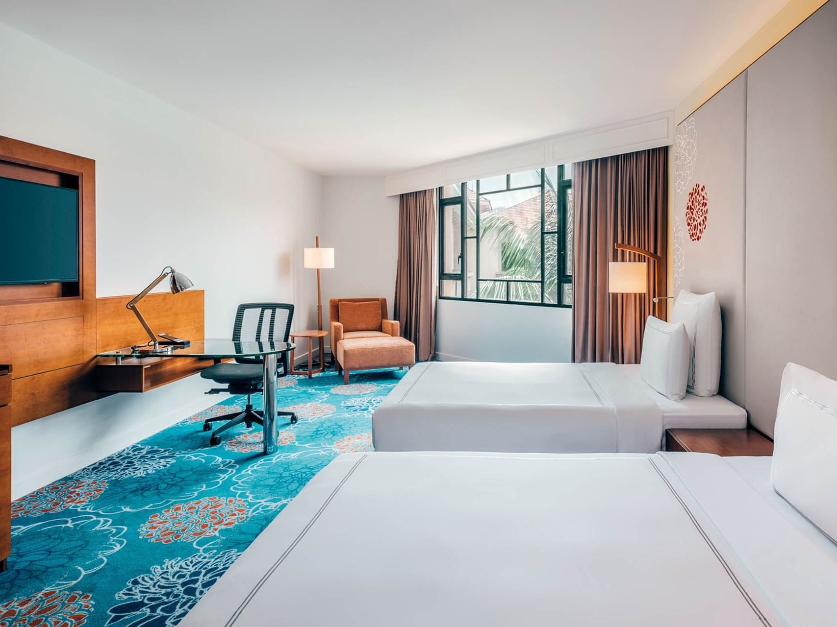Beds, TV & desk in Premier Double Room at Paradox Singapore